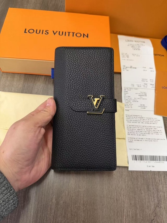 Louis Vuitton Handbags - Louis Vuitton Black Pebbled Leather Long Wallet with Gold LV Emblem